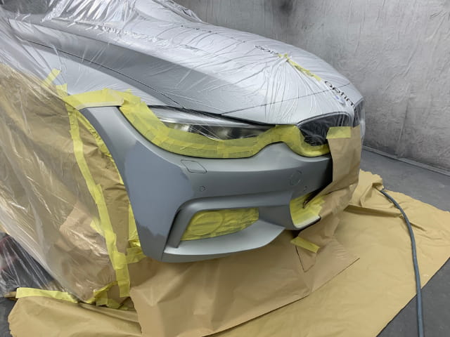 The BMW prepared for paint in the spray paint booth