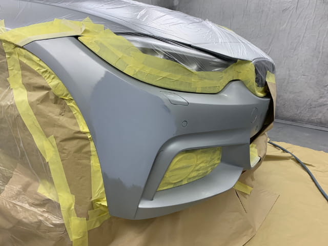The BMW prepared for paint in the spray paint booth
