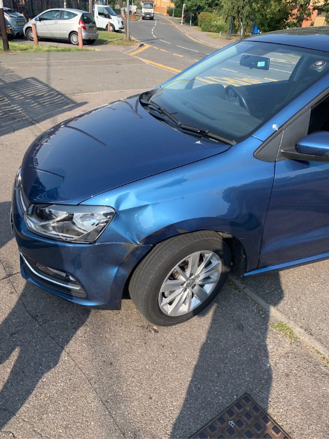 The dented wing of the Volkswagen
